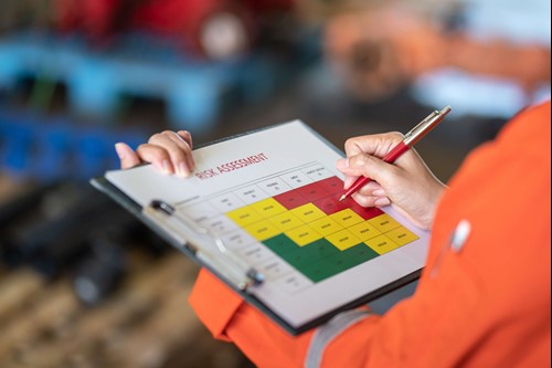 A safety representative completing a safety checklist health and risk assessment