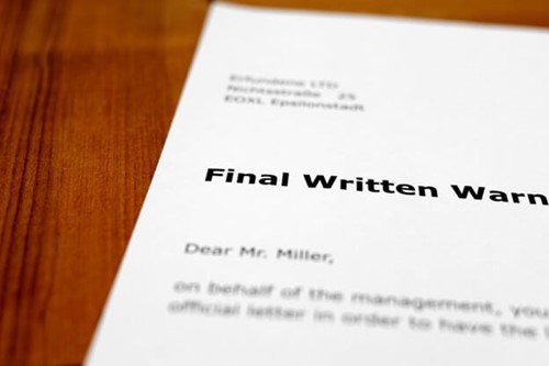 an employee receiving their final written warning letter after two written warnings in the disciplinary process